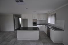 35 Lawson Circuit Lavington NSW 2641 $365,000 This near new home has plenty to offer young and growing families offering space and comfort located in a new estate. The home comprises of 4 bedrooms, master bedroom has ensuite and walk-in robe, built-in robes to other 3 bedrooms, separate formal lounge room, spacious kitchen complete with gas appliances and dishwasher, open plan family meals area, full bathroom with separate toilet and ducted heating and cooling throughout. Outside offers a covered entertaining area, landscaped yard complete with electronic watering system to gardens and remote double lockup garage with internal and back yard access. Only a few years young this is an easy choice for those buyers wanting to tick everything off their wish list Property ID: 1P1884 Property Type: House Land Size: 692.6m² approximately Garage: 2 Outgoings: Water Rates: $830.40 Yearly Council Rates: $1307.04 Yearly Features: Air Conditioning Heating Built-In Wardrobes Ensuite Property Overview Near New Well Presented & Well Sized Home For Sale - $365,000 4 beds | 2 baths | 2 cars