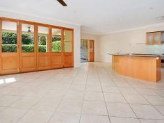 98A Bayview Terrace Clayfield QLD 4011 Family Living at Its Finest in Clayfield! Comfort, Convenience and Location Step into this beautifully presented, low maintenance, contemporary 2 storey home in the heart of Clayfield. Double front doors invite you to an overwhelming feeling of open spaces and easy living for you and your family. This property has everything and more... Life doesn't get any easier with all your needs at the doorstep. Transport, restaurants, sports facilities and highly sort after schools share this address. The home itself is set over two levels. On ground level, a wide tiled hallway leads off to a study, formal lounge and formal dining room, flowing through to a comfortable open plan living area and spacious modern kitchen with stone benchtops, plenty of cupboard space and an informal dining nook off to one side. Walk through beautiful, solid timber bi-folds onto a large screened and tiled patio and into the private hedged courtyard, providing you a peaceful haven. Perfect for entertaining or just relaxing with your family. Downstairs also has a 5th bedroom of generous size with built ins, well laid out laundry and a modern bathroom/powder room. Upstairs and into more wonderful open living areas with a huge entertainment /home theatre complete with screen and projector, 3 very generous double bedrooms all with built ins and through more double doors to the master suite, with its custom fitted walk-in robe and luxurious ensuite with double shower. There is also a spacious family bathroom with separate toilet on this level. Storage will never be a concern. The home has plenty, with a massive walk in linen press, laundry shoot and loads of cupboards throughout. There is also a very neat and secure garage accessible directly from the house and a separate carport attached. This property presents you with a clean palate and is ready for you to make your home. Other features include: • Wool berber carpet and tiles throughout • Security gates, intercom and security system • Vacumaid, ducted air con and a convenient laundry shoot • Neutral colour scheme and discrete downlighting • Quality kitchen fit out with 900mm chef's oven • Close to Eagle Junction State School and Clayfield Colleges • Transport and all amenities a short stroll