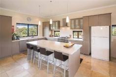 293 Stevens Rd Witchcliffe WA 6286 $1,595,000 Luxurious Estate 4 3 16 15 acre (approx) This magnificent homestead is set on 14 acres of undulating parkland right in the heart of the Margaret River wine region. The custom designed home makes the most of the north facing aspect and has been thoughtfully planned to make best use of its solar passive aspect. Designed in two living wings with a connecting foyer, the enormous open plan living/kitchen/dining wing comprises a modern well appointed kitchen, expansive sandstone tiled flooring and view capturing doors which open onto the large covered outdoor deck that soaks in the tranquil atmosphere of the landscaped gardens complete with lily pond. Conduct business from home with ease as there is a separate study located adjacent to the entrance door. The bedroom wing is cleverly designed with three double size bedrooms surrounding a second loungeroom that also overlooks the gardens and opens directly onto the north facing verandah. The main bedroom has the indulgence of a walk through robe that leads into a sumptuous ensuite. A second bathroom and separate WC (complete with exterior vanity) is located closer to the remaining bedrooms. Modern stylish tiling, carpeting and fixtures and fittings are evident throughout the entire home and provide a sense of luxury and comfort. If this luxurious home isn't enough for the family, there is a modest cottage located in the valley of the property. Nestled amongst trees, this accommodation would be the ideal pad for the teenager or extended family or rent out to paying tenants, as it consists of a bedroom, open plan living and a bathroom. A spacious elevated deck leading out from the living area overlooks lush lawns and a picturesque spring fed 50m x 40m x 3m deep dam. A large 17.5m x 7.5m powered colourbond shed with concrete floor to two bays is situated between the main house and cottage and provides ample space to store all of the equipment. An area of this shed has been decked out into a games room/living quarters, providing even more space for the kids and extended family. Abutting Leeuwin Estate and neighbouring Voyager Estate wineries, only 9 kilometres from the Margaret River townsite and only 6 kilometres from the coast, live in luxury on the land knowing that the conveniences of town are only a short drive away and the beauty of the region is all at your doorstep.