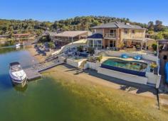 18 Bosun Blvd Banora Point NSW 2486 $1,249,000 OXLEY COVE - SERIOUS BOATIES DEEPWATER POSITION Be boating, skiing and fishing within 2 minutes in the beautiful main Tweed River with no speed restrictions and easy ocean access. The large entertaining home with outdoor covered entertaining area and BBQ patio sits on a spacious 846m2 corner lot with 27m frontage to deep water and sandy beach. Side access to back the ski boat down to the concrete boat ramp. The pontoon can hold a 40-50 ft craft. Live the dream at below replacement cost if you could get a vacant lot that is. - Infinity wet edge in-ground pool - Water views from living areas, kitchen + large main bedroom - Gourmet kitchen with granite bench-tops - Ducted air conditioning - Solar hot water - Security system - Room to park extra vehicles - Fully fenced front yard - High ceilings - Study Price $1,249,000 Suburb Banora Point Region Northern Rivers Postcode 2486 Property Type House Sale Private Treaty Bedrooms 5 Bathrooms 3 Carspaces 2 Land Size 846 m2