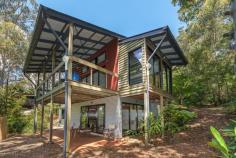 51 Knoll Road Tamborine Mountain QLD 4272 $625,000 Designed by the same talented architects behind the well-known 'Binna Burra Lodge', this home is one of the most private homes on the mountain! Sitting at a perfect N/NE aspect, and with a variety of living options to choose from, the opportunities for further growth and personalisation are endless. Combine this with the fact that the mountain is now home to over 1 million tourists each year, and you have the exact recipe for lifestyle and success. Built by 'Ludwig', again on the most sought-after builders in the Hinterland area, only the highest quality materials have been used in construction. Features include: - Good size bedrooms spread over split levels - Open plan living with plenty of natural light and views of the natural surroundings - Fireplace in lounge/family area - Kitchen with plenty of bench space, island bench and lots of storage - Modern bathrooms with chic finishes - Opportunity for teenage retreat, granny flat, business from home With National Parks situated on both your Northern and Southern boundaries, and connecting rainforest gardens already established on the property, there is no better privacy or seclusion required, to create your own private oasis and take in the magical atmosphere offered by mountain living. With plenty of extra land still available and ideally suited to a pool, terraces or entertainment areas for guests, bring your builder and start dreaming of options to personalise this home and make it your very own creation. Inspections welcome by appointment. Disclaimer: We have in preparing this information used our best endeavours to ensure that the information contained herein is true and accurate, but accept no responsibility and disclaim all liability in respect of any errors, omissions, inaccuracies or misstatements. Features Deck Fenced Undercover outdoor area Outdoor entertainment area Balcony Smoke Alarms Property Details Bedrooms 3 Bathrooms 2 Off Street Parking 2 Land Area 1186 m2
