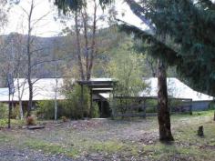 135 Elliott Way Tumbarumba NSW 2653 $349,000 Mudbrick home on 12 acres This unique property is located only 18kms from Tumbarumba and 60kms from the Mount Selwyn snowfields and will suit those looking for seclusion & tranquillity all in one. Situated on a 12 acre block with frontage to Paddy's River and a 2 bedroom mud brick home that's exudes ambience and character. The home features: 2 bedrooms both with built-ins, both opening out to the verandahs, Open plan kitchen, lounge and dining with wood heater, wall mounted a/c and ceiling fans, Combined bathroom and laundry - separate toilet, Kitchen with gas and wood cooking and a walk-in pantry, Verandahs on three sides with peaceful rural outlooks, Single carport attached. Additional property features: 18.3 x 6.1m shed with self contained living quarters, Divided into 4 paddocks, Dam and pump at creek, 2 x 10,000lt rain water tanks to garden & fire fighting units, 15,000lt &10,000lt rain water tanks to house, Chook pen, Established gardens full of colour plus gazebo, Several other sheds for wood and storage. Property Amenities & Features General: Reference: 436 Property Type: Residential Category: AcreageSemi-rural Bedrooms: 2 Bathrooms: 1 Parking: 1 Features: Open Homes Private viewings available by appointment