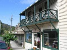 72 Princes Hwy Cobargo NSW 2550 $295,000 Positioned in the main street of Cobargo is this historic shop c1895, residence and studio. The residence features three bedrooms, balcony overlooking Cobargo's main street, bathroom and open fire. The shop is fitted out with good sized kitchen, rear deck for entertaining, large yard and established gardens. The studio is open plan in a private setting at the rear of the premises. Ideal for a teenage retreat. The shop and residence is ideal for those who are waiting to live and work from home. Tourist traffic ensures there is plenty of passing trade. Cobargo is a popular stop for the travelers with plenty of curio shops, cafe's, hotel, bakery and news agency. Features Balcony Verandah Property Details Bedrooms 3 Bathrooms 1