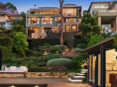 81 Minimbah Rd Northbridge NSW 2063 Elevated above the stunning waters of Sailors Bay, this north facing family home showcases a world class renovation and rare entertaining potential. It is set across a deep waterfront reserve block on Northbridge's finest street, moments from village life. Interiors by Hecker Guthrie, landscaping by Secret Gardens Expansive lounge/dining areas seamlessly flow to the terrace Heated Bisazza mosaic tiled pool/spa, self-contained cabana Italian Bedonia stone kitchen includes Gaggenau appliances Vast rumpus room, private decks embrace northern sunshine Cavelier Bremworth carpeted bedrooms with built/walk-in robes Luxe bathrooms, impressive master, study and versatile loft American oak and polished concrete floors, abundant storage Fully irrigated garden, guesthouse/cabana, Jetmaster fireplace Internal access double garage plus extra off street parking FEATURES Built-in Robes Balcony Internal Laundry Dishwasher Fireplace Swimming Pool Fenced Foxtel Spa Deck 5 Beds 4 Baths 2 Cars Elevated above the stunning waters of Sailors Bay, this north facing family home showcases a world class renovation and rare entertaining potential. It is set across a deep waterfront reserve block on Northbridge's finest street, moments from village life. Interiors by Hecker Guthrie, landscaping by Secret Gardens Expansive lounge/dining areas seamlessly flow to the terrace Heated Bisazza mosaic tiled pool/spa, self-contained cabana Italian Bedonia stone kitchen includes Gaggenau appliances Vast rumpus room, private decks embrace northern sunshine Cavelier Bremworth carpeted bedrooms with built/walk-in robes Luxe bathrooms, impressive master, study and versatile loft American oak and polished concrete floors, abundant storage Fully irrigated garden, guesthouse/cabana, Jetmaster fireplace Internal access double garage plus extra off street parking FEATURES Built-in Robes Balcony Internal Laundry Dishwasher Fireplace Swimming Pool Fenced Foxtel Spa Deck UPCOMING INSPECTIONS Saturday 5 December 10.00am - 10.30am Saturday 12 December 10.00am - 10.30am SALE METHOD Private Treaty