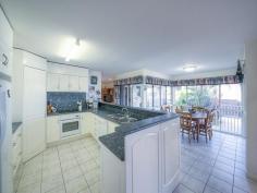 19 Callaghan Dr Taranganba QLD 4703 $620,000 PRICE DROP...Take a sencond look, This is a MUST see It would be easy to appreciate the very workable traditional kitchen in this home, then when its time to eat, sit in the dining room and look over the pool area through the roof to floor windows which surround the dining table. A great place to sit and take in the sun when it starts getting a bit nippy. With 2 living rooms being in separate areas of the home means a couple of beers and the footy can be on the TV in one room and a chocolate, bag of popcorn and a good movie on the TV in the other. There are 4 generous sized bedrooms, 2 of which are classed as main bedrooms with an en-suite off each. The main bedrooms are at either end of the home which makes it easy for everyone to have their own space. There is also a main bathroom for the other 2 bedrooms of which could both fit a queen bedroom suite. Invite the family or friends over for a barbie, sit around under the covered area and chat all while having the feel of being in your own private hideaway. Take a dip in the pool and if its too cold hop under the outdoor heated shower to warm up. The laundry has easy access to the clothesline from the fully lockable double car garage. The floor on the garage has seamless flooring that makes an easy to clean surface, so there would be no problem cleaning up oil leaks or petrol spills. The sea view is just an added bonus to this complete package. This fully air-conditioned, very well built, presentable home inside and out with 20 solar panels installed is a must see, so make an appointment to inspect as you won't be disappointed. Property Snapshot Property Type: House Features: Air Conditioning Built-In-Robes Close to schools Close to Transport Ensuite Established Gardens Family Room Fenced Back Yard In-Ground Pool Remote Control Garaging Security Screens Undercover Entertainment Area Waterview