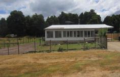 16 Ardyn Street Tullah TAS 7321 $75,000 Country Living Situated on 1012 M2 of land, this four bedroom home gives you the feeling of real country living. The hills and mountains surrounding Tullah have a beauty all of their own. Located just 10 minutes from Rosebery and an hour from Burnie, this is the best of both worlds. The glassed in front verandah is an ideal place to sit and read and or relax. The open plan lounge/dining has a free standing wood heater and electric heating. The galley style kitchen has plenty of cupboards and storage, the laundry large and the bathroom extra roomy. The property is on mains water and sewerage, and two storage sheds at the rear. Inspection is by appointment only. Please contact our sales consultant for further information. 4 Bedrooms Lovely views Choice of heating Large lounge/dining Land size 1012M2 General Features Property Type: House Bedrooms: 4 Bathrooms: 1