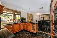 9 Ryan Rd Pickering Brook WA 6076 $1.8 million LIFESTYLE PLUS! PLUS! PLUS! VIEW BY APPOINTMENT A RARE opportunity to secure your 'Dream Lifestyle.' Seldom do properties such as this come on the market. Set on 11.9 acres (4.831Ha) zoned Rural Agricultural and surrounded by orchards, horses, emus, donkeys, the list goes on. Backing ont State Forrest yet within 30 minutes of the city......WOW! This double storey property consists of (but is not limited to)..... * Four Bedrooms - Three upstairs and one downstairs in a possible granny flat/teen retreat area under the main roof. - The main bedroom suite is extensive, with a seperate dressing room, ensuite and balcony to take in the fantastic views. - All other bedrooms are a good size with built in robes.The rear double bedroom opens out onto a large balcony overlooking the pool area and with views to the forest. * Three magnificent bathrooms - Two upstairs and one in the granny flat wing - The ensuite to the main bedroom suite has been recently renovated with floor to ceiling travertine...just beautiful. - Free standing bath, double wash basins and large walk in wet room/shower - Also recently renovated the two other bathrooms are tiled floor to ceiling with marble tiles and have double sized showers. * The kitchen is finished with oak cupboards and black granite bench tops, intergrated fridge/freezer and dishwasher. Stainless steel oven and ceramic hob complete the picture * The laundry is adjacent for easy access with a door leading to the rear patio. * Three seperate living areas - Dining/family area open plan, tiled, and next to the kitchen - The large formal lounge is carpeted and has a wood fire - Games room, tiled * Outside you have: - Below ground pool, large freestanding colorbond gabled patio - Horse stables with 3 stalls. * Tack room - Hay/machine shed - Bore, 2 dams, water tank Additional features are: * 2x ducted evaporative air conditioning systems. One for upstairs and one for down. * Reverse cycle air conditioning system to the granny flat area. * Store cupboards x2 * Large upstairs landing and impressive double door entry * Reticulated formal gardens. * Tinted windows. This property has so much to offer. The granny flat area could also work as a bed and breakfast business (with council approval). All the plumbing is still in place to convert the study back into a kitchen. Property Details Elders Property ID: 9242809 4 bedrooms 3 bathrooms 2 car parks Land Area 4.831 hectares Double carport Air Conditioning