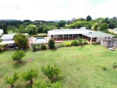 41 Kiel Mountain Rd Woombye QLD 4559 THIS LARGE DUAL LIVING WOOMBYE WINNER ON ACREAGE HAS EVERYTHING RIGHT ON THE DOORSTEP - YOUR PERFECT SC HINTERLAND FAMILY BASE AWAITS! Occupying an elevated breezy position just four minutes from Woombye village, this home offers an enormous range of options for the large or extended family, promising the perfect balance of indoor & outdoor hinterland living. - 1.9 acres with north-west views to Blackall Range - Adjoined yet separate dual living on one level - 5 bedrooms with built-in robes - 3 bathrooms, 2 with separate toilets, 1 ensuite - Study/ Office - 2 Lounges, 1 with combined dining - 1 Formal dining room - 2 Kitchens, with breakfast areas and electric appliances - Solar and electric hot water - Air-conditioning - Fans in all rooms - Undercover BBQ / entertaining area - Gardens - Numerous established fruit trees - Garaging for 3 vehicles, extra high double Carport, RV/ Caravan parking - Workshop/ Garage, Shed - Town water, Tank Water 2 x 10,000 ltr, 1 x 7,000 ltr plus Bore for watering gardens - Inground Swimming Pool - Shared, private driveway Plus lots more Solidly built from brick under tile roof with an impressive entrance portico this single storey 1980's property on just under two acres is essentially two great homes in one. The main wing provides three good sized bedrooms (main with ensuite) plus compact study, open plan lounge/dining, family kitchen, bathroom & laundry whilst the conjoined 'annexe' which can be separately accessed offers a full kitchen, two bedrooms, living room, bathroom & laundry. Both have direct access onto the wonderful rear covered patio - the perfect venue for entertaining in all weathers and with beautiful far-reaching north-west views towards Blackall Range. Adjacent are a fenced north facing pool and detached large shed which back on to the larger part of the land, planted predominantly with a good number of mature citrus trees (mandarin, orange & lime) plus avocado, mangos and olives. Aside from integral double garaging to the front of the house there's a separate covered RV/caravan parking area with hard standing, a good sized lawn and low maintenance beds with easy care planting. Town supply, bore and tank storage ensure the home never runs short of water and allows selective switching if required for irrigation. In summary, this substantial property offers a fabulous opportunity to update or reconfigure the interior as required - or leave exactly as is - the choice is entirely yours. The location could not be more convenient too - just 15 minutes to the coast, 15 minutes Blackall Range, 75 minutes Brisbane, 30 minutes Noosa, 20 minutes local airport plus a choice of rail stations and 6 excellent schools right on the doorstep! Very rarely does such a versatile quality home offering entirely separate extended family living come to market, so don't miss your chance. Inspections by appointment, please phone Elaine Gentles on 0415 367 787 or Martin Fisher on 0415 356 170. Other features: Built-In Wardrobes,Close to Schools,Close to Shops,Close to Transport,Garden Property Details Elders Property ID: 9261247 5 bedrooms 3 bathrooms 7 car parks Land Area 7809 square metres Car Parks: 2 3 car garage Double carport Swimming Pool Air Conditioning