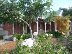 161 Avon Terrace York WA 6302 $525,000 Circa 1920 Colonial Beauty This beautifully presented circa 1920 colonial brick & iron home offers three large bedrooms, formal sitting room and superb new open plan kitchen/dining with granite bench tops, polished floors, high ceilings, reverse cycle ducted air cond, ceiling fans and double oven. The property is complete with large North facing patio, outdoor spa, solar HWS, double lockup garage and double carport, 2x2500gal rainwater tanks all on a 1072m2 block in central town location. This property is well worth inspection. Property Details Elders Property ID: 8319128 3 bedrooms 1 bathrooms 4 car parks Land Area 1072 square metres Double garage Double carport