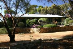 10 Sharow Pingelly WA 6308 $359,000 Your Private Garden in The Country If you want to get away from it all while remaining close to amenities, it's hard to beat this lovely home in Pingelly. The property itself features a modern three bedroom home with open living areas, verandahs front and rear and quality fittings throughout. With solar hot water, ducted air conditioning and reverse cycle air conditioning in the main living area. The home has been well maintained and is in very good condition - you can move in with nothing to spend.There are many trees and shrubs in the landscaped and fully reticulated gardens where levels have been defined by quality stone retaining walls. There are several outdoor entertaining options, and extensive off street parking for your friends or room for the kids to play (check out the cubby house!). If you have a few toys there is a steel framed 6 x 9 metre shed with power connected and several smaller outbuildings. Pingelly is a peaceful country town, easy driving distance from Perth, where the local council is in the process of building a new medical centre and large sporting complex and recreation centre. Before you buy elsewhere take a look at the new Pingelly and start a new life in the country. Other features: Built-In Wardrobes,Close to Schools,Close to Shops,Fireplace(s),Garden,Secure Parking Property Details Elders Property ID: 8057209 3 bedrooms 2 bathrooms 8 car parks Land Area 4294 square metres Car Parks: 6 Double garage Air Conditioning