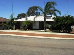 10 Janes Dr Corrigin WA 6375 $215,000 SOLID BRICK HOME Situated in quiet area of Corrigin this well kept double brick and colour-bond constructed 3 bedroom, 1 bathroom home represents good value buying. It has recently been renovated in the bathroom and newly painted throughout. Boasting a large kitchen/lounge area. It also features a large undercover outdoor area and lockable double garage. Solarhart hot water system. Well worth a look at $215,000. For Further details or to arrange your viewing please contact local real estate agent Roger Norrish at Elders Corrigin 08 9063 2102. Other features: Close to Schools,Close to Shops Property Details Elders Property ID: 5069042 3 bedrooms 1 bathrooms 2 car parks Land Area 1013 square metres Double garage Air Conditioning