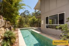 19 Grove Creek Cl Reedy Creek QLD 4227 Surrounded by nature Property ID: 9232061 Upon entering this home the hardwood timber floors create an immediate warm and inviting ambience and lead you to the ground level living spaces and bedrooms. Entering the large living/dining area one can only be impressed by the soaring raked ceilings and large windows with 180 degree views of the bush canopy. This home is positioned to capture the cooling breezes channelled up the adjacent valley and is supplemented by split cycle air conditioning which cools the whole home and enhances your year round comfort. Adjacent to the open plan living/dining is the spacious chef’s kitchen with stone bench tops, quality stainless steel appliances and ample bench space plus a butler’s pantry to make sure entertaining on a grand scale is accomplished with ease. The living/dining area opens to the large rear verandah which gives you plenty of room for alfresco dining under roof whilst enjoying views of the nature reserve beyond … let the birds provide the music! To the left of the entrance is internal access to the auto double lock up garage and just beyond this is a good sized study/ home office with a lovely view over the pool and nature beyond. To the right of the entrance is a Media/Library or 2nd living area, two large bedrooms with mirrored robes, served by a 3 way bathroom with quality fixtures consisting of a large bath and shower room with vanity and large linen cupboard, separate toilet and separate vanity area serving the wc. Timber stairs lead downstairs to a fully tiled rumpus room which opens to the huge patio area and overlooks the swimming pool so you can keep a keen eye on all. Behind the rumpus is a guest bathroom and a large family laundry. To the right down the hall is a guest bedroom then a private master suite with a generous ensuite with separate powder room. Walk through the Harry Potter door under the staircase to the huge workshop and storage area, perfect for wine cellering or for the handyman. You wont miss the 10,000ltr water tank down here either. This workshop area also has side access. Below the house is the terraced garden comprising a modest orchard of fruit trees, vegie plots and Australian natives planted abundantly to bring the native birds into the property. This is a contemporary style home with nature abounding and offers a tranquil lifestyle to enjoy and unwind with your family and friends. The “Observatory” is an award winning Stocklands estate with parks and play areas to explore and with views which capture the Surfers Skyline and beyond to the Pacific Ocean. This home is at the foothills and is only minutes away from shops, schools, rail & M1. This is the first time this home has been offered for sale as the owners are downsizing and have purchased close by. They are hoping you too will love the ambience of their home and the aviary in which they live. We look forward to your successful private tender before its close on 19th February 2016 by 5pm.