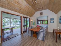 75-77 Tramican Street Point Lookout QLD 4183 $2,300,000 Both blocks are a total of 1,800m2 and have wonderful beach, bush and ocean views. The large architecturally designed house has a two car lock up garage at street level which links to the house with a timber walkway. The garage building has a large loft area - perfect for a craft room, office or even a separate studio bedroom and lockable storage areas underneath. The main house has two levels with all living areas on the top level. There is a formal lounge area on entry, large open plan kitchen with walk in pantry plus formal dining - all opening onto a covered deck. There are two bedrooms and a bathroom on this level also. The bottom level has three more bedrooms including the master bedroom with walk in robe and en suite bathroom, a second bedroom also has an en suite with spa bath and there is a small bunkroom The separate laundry with large storage area (perfect for a wine cellar) has direct access to the garden.
