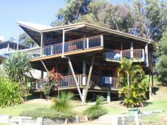 94 Tramican St Point Lookout QLD 4183 $975,000 Architect Designed Home on Tramican Street This two storey pole house has been built to take advantage of the views and the northerly aspect. There are decks on both levels with the top level being open plan lounge, kitchen and dining all opening onto the deck. There are also two bedrooms with built ins, a family bathroom and a separate toilet. Downstairs there is a large third bedroom, a second bathroom with a bath and separate toilet. There is a level parking area at the front of the property and lots of garden - even the possibility of erecting a second dwelling.