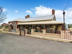 8 High St Strathalbyn SA 5255 $319,950 OPEN SATURDAY 23/4/2016 - 11AM - 11:30AM Property ID: 8668062 “Stone Gate Cottage c1860 Standing the test of time and proudly sited on historic High Street is this charming bluestone return verandah villa. The character home is positioned on a manageable 468m2 allotment within a stone’s throw to township facilities. The traditional floor plan features a spacious family lounge, formal lounge, kitchen with dishwasher, dining room, 3 bedrooms, renovated bathroom, laundry and a delightful cellar. The villa has many quality features including polished timber floor boards, operational open fireplaces with appealing surrounds, glass panelled interior doors, combustion heating and reverse cycle split system air conditioning. Attached to the rear of the home is a quaint paved outdoor living area with caf blinds ideal for year round entertaining. Further external improvements include a double carport, 6.2 × 6.3m colorbond lock up garage complete with cement floor and power and rainwater storage plumbed to the home. The location of this property, being adjacent to the northern end of the popular antique centre is well placed for many uses including Bed & Breakfast and professional services, notwithstanding the fact that the property is located within the township zone code of Residential (Strathalbyn) Precinct 23 Strathalbyn Historic Central, and any change would necessitate Council approval. Property History- John Stephens, a butcher acquired an L shaped part of Lot 38 in 1860. In 1861 it passed to William Stephens, a blacksmith. From 1866 Stephens leased the property to other blacksmiths. The section behind William Read’s allotment was sold off to Colin Thomas in 1884. The remaining part of the property was transferred to Isaac Wheadon, a blacksmith, a few weeks later. Wheadon has leased this property and part of Lot 39 from William Stephens before purchasing it. Wheadon mortgaged the property to William Stephens and Stephens gained possession later in 1884. Robert Thomas acquired the property in 1908 and it was subdivided in 1920. Henry Marshall Hall Robinson bought this part of the land in 1921. He sold it in 1923 to George Thredgold, a mason, who owned until his death in 1938. Land Area 468.0 sqm