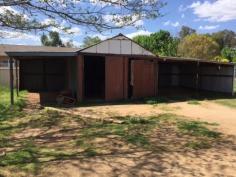 94 Rodd St Canowindra NSW 2804 $165,000 Home in Town on Half an Acre This three home is situated in a convenient position in town and is walking distance from shops, parks and schools. It sits on some 2023m2 square metres in area with an established stable, plus a side driveway that accesses the lock up garage and 2 carports. The lounge is oversized and boasts a slow combustion heater to warm you on those frosty nights. While there is ducted evaporative cooling throughout, for the warmer days. The kitchen is generous in its size and offers plenty of bench and cupboard space and could accommodate an additional breakfast table. There is the opportunity to add your style or just move in and enjoy, the choice is yours. Perfect for the home buyer or some one who is looking to move into town keeping the feeling of space. Property Snapshot Property Type: House Construction: Brick Veneer Land Area: 2,023 m2 Features: Built-In-Robes Close to schools Close to Transport Fenced Yard Formal Lounge Garden Shed Town Sewer System Town Water Verandah