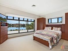 84 Henley Marine Dr Rodd Point NSW 2046 Luxurious Residence with Panoramic Bay and City Views Built to discerning standards, this landmark waterfront home has been crafted to take full advantage of panoramic views over Iron Cove and the city skyline. Designed by renowned architect Peter Lufi to mirror the curves of the bay, it combines a house-like layout with the convenience of apartment style living and features a flexible layout easily reconfigured for dual occupancy. Right on the doorstep of the Bay Run and Rodd Park, its grand interiors, high-end finishes and never-to-be-built-out views create a spectacular residence. * Expansive upper level living bathed in northerly sun * Entertainer's custom granite kitchen, walk-in pantry * Deep terraces, Vergola, dazzling unobstructed views * 4 bedrooms with built-ins, Villeroy & Boch baths * Master with walk-in robe and large marble ensuite * Versatile lower level with 2 beds, living & courtyard * DLUG (internal access), storeroom, gated drive * Powder room, huge laundry, ducted air and vacuum * Exclusive waterfront setting, easy access to the CBD Inspections are strictly by appointment. All information contained therein is gathered from relevant third party sources. We cannot guarantee or give any warranty about the information provided. Interested parties must rely solely on their own enquiries. Property Snapshot Property Type: House Construction: Double Brick Features: Balcony Built-In-Robes Cable Television Close to schools Close to Transport Ensuite Internal Access via Garage Storage Study Undercover Entertainment Area Walk-In-Robes Waterview