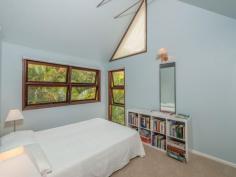 75-77 Tramican Street Point Lookout QLD 4183 $2,300,000 Both blocks are a total of 1,800m2 and have wonderful beach, bush and ocean views. The large architecturally designed house has a two car lock up garage at street level which links to the house with a timber walkway. The garage building has a large loft area - perfect for a craft room, office or even a separate studio bedroom and lockable storage areas underneath. The main house has two levels with all living areas on the top level. There is a formal lounge area on entry, large open plan kitchen with walk in pantry plus formal dining - all opening onto a covered deck. There are two bedrooms and a bathroom on this level also. The bottom level has three more bedrooms including the master bedroom with walk in robe and en suite bathroom, a second bedroom also has an en suite with spa bath and there is a small bunkroom The separate laundry with large storage area (perfect for a wine cellar) has direct access to the garden.