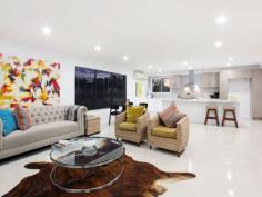 39 Mingaletta Dr Ashmore QLD 4214 $675,000 - $725,000 Seeking a Home with the Wow Factor? Look No Further! No expense has been spared in this amazing renovation, its the little extras that make the extraordinary difference in this gorgeous contemporary residence. Featuring an oversized grand timber door entrance flowing onto a custom built solid timber staircase that leads you into the large air conditioned open plan living area which incorporates indoor/outdoor living effortlessly. Houses of this calibre in this price range have been flying out the door so please don't delay as this beautiful abode will be no different! * Huge mastersuite with full length walk in robe and fully renovated ensuite * Oversized 4th bedroom with high raked ceilings (could be used as a second living area, children's retreat or home office) * Enormous chefs kitchen with stone benchtops, 2pac cupboards, gas cooktop and large breakfast bar * Beautiful second bathroom with freestanding bath, large shower. * Powder room with direct access from outside to avoid water from the pool being walked through the house * Large undercover outdoor area with bar/servery overlooking the in-ground swimming pool * Lots of grassed areas for the children or pets throughout the large 790m2 allotment * Brand new colorbond roof with new insulation and warranty * Double lock up garage with new Pirie electric double door * New LED lighting and ceiling fans throughout
