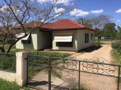 94 Rodd St Canowindra NSW 2804 $165,000 Home in Town on Half an Acre This three home is situated in a convenient position in town and is walking distance from shops, parks and schools. It sits on some 2023m2 square metres in area with an established stable, plus a side driveway that accesses the lock up garage and 2 carports. The lounge is oversized and boasts a slow combustion heater to warm you on those frosty nights. While there is ducted evaporative cooling throughout, for the warmer days. The kitchen is generous in its size and offers plenty of bench and cupboard space and could accommodate an additional breakfast table. There is the opportunity to add your style or just move in and enjoy, the choice is yours. Perfect for the home buyer or some one who is looking to move into town keeping the feeling of space. Property Snapshot Property Type: House Construction: Brick Veneer Land Area: 2,023 m2 Features: Built-In-Robes Close to schools Close to Transport Fenced Yard Formal Lounge Garden Shed Town Sewer System Town Water Verandah