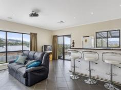 39 Snug Tiers Rd Snug TAS 7054 $599,000 If its space you're after, this property has it! This impressive double storey home has plenty of room for the entire family. Situated on a flat block (approx. 2378m2) where children and pets can safely play all day long. Park the caravan, boat, trailer and anything else… there is loads of room for everyone. Upon entering the home, the quality of the home is evident. All of the spacious bedrooms have built-in-robes and the master has walk-in-robes and an ensuite. The top level of the home has two great entertaining areas. One being the tasteful kitchen/dining/lounge area and adjacent is the family/theatre room that has its own projector screen and speaker system. There is even a great built-in bar. Also off the top level is an enormous suspended concrete deck with full length cover making it the ideal alfresco dining or party area. The house has nice views of the D'entrecasteaux Channel to Bruny Island also lovely views of Mount Wellington. The entire home has ducted air conditioning, regulating the temperature throughout the year. Ground level has a remote controlled double garage, big laundry and 2 multi-purpose utility rooms. A short stroll down the road has Snug Primary school, shops and services all well within your sights. So if it is space you're after, this modern, spacious home is well worth a look. Property Snapshot Property Type: House House Size: 306.58 m2 Land Area: 2,378 m2 Features: Airconditioning Built-In-Robes Dishwasher Ensuite Verandah Walk-In-Robes