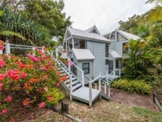 75-77 Tramican Street Point Lookout QLD 4183 $2,300,000 Both blocks are a total of 1,800m2 and have wonderful beach, bush and ocean views. The large architecturally designed house has a two car lock up garage at street level which links to the house with a timber walkway. The garage building has a large loft area - perfect for a craft room, office or even a separate studio bedroom and lockable storage areas underneath. The main house has two levels with all living areas on the top level. There is a formal lounge area on entry, large open plan kitchen with walk in pantry plus formal dining - all opening onto a covered deck. There are two bedrooms and a bathroom on this level also. The bottom level has three more bedrooms including the master bedroom with walk in robe and en suite bathroom, a second bedroom also has an en suite with spa bath and there is a small bunkroom The separate laundry with large storage area (perfect for a wine cellar) has direct access to the garden.