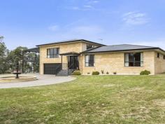 39 Snug Tiers Rd Snug TAS 7054 $599,000 If its space you're after, this property has it! This impressive double storey home has plenty of room for the entire family. Situated on a flat block (approx. 2378m2) where children and pets can safely play all day long. Park the caravan, boat, trailer and anything else… there is loads of room for everyone. Upon entering the home, the quality of the home is evident. All of the spacious bedrooms have built-in-robes and the master has walk-in-robes and an ensuite. The top level of the home has two great entertaining areas. One being the tasteful kitchen/dining/lounge area and adjacent is the family/theatre room that has its own projector screen and speaker system. There is even a great built-in bar. Also off the top level is an enormous suspended concrete deck with full length cover making it the ideal alfresco dining or party area. The house has nice views of the D'entrecasteaux Channel to Bruny Island also lovely views of Mount Wellington. The entire home has ducted air conditioning, regulating the temperature throughout the year. Ground level has a remote controlled double garage, big laundry and 2 multi-purpose utility rooms. A short stroll down the road has Snug Primary school, shops and services all well within your sights. So if it is space you're after, this modern, spacious home is well worth a look. Property Snapshot Property Type: House House Size: 306.58 m2 Land Area: 2,378 m2 Features: Airconditioning Built-In-Robes Dishwasher Ensuite Verandah Walk-In-Robes