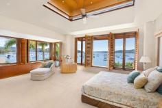 1802 Pittwater Rd Bayview NSW 2104 $7,500,000 A flawless absolute waterfront set on 1,130sqm 'Semloh' boasts a coveted northerly aspect and timeless architectural design by the renowned Walter Barda. This exquisite masterpiece represents the very best that the area has to offer, with direct Pittwater views captured from virtually every room and only 45 minutes to Sydney CBD. One of the few Bayview properties providing significant water depth at all tides, its impressive range of facilities can accommodate a large boat of up to 50 feet. There's a 107sqm jetty plus a slipway, fully equipped boatshed and a private sandy beach. Vast interiors are warm and inviting with abundant natural light. They include formal and informal living and dining areas, a billiard/a/v room, study and a self-contained lower level with a bar, wine cellar and a sauna. The property displays extensive use of bespoke timber throughout, while the floors are an attractive blend of Italian limestone and recycled blackbutt. Entertaining spaces comprise a gas heated salt water pool and spa, large deck, Tuscan inspired courtyard and a terrace. Four bedrooms have ensuites and the lengthy gourmet kitchen offers St George/Miele fixtures plus a walk through pantry. Other features include two gas fireplaces, alarm, air conditioning, ducted vacuuming, plantation shutters and a four car garage. Enjoying an immensely tranquil setting with direct access to boating clubs, this enviably private double brick home is simply extraordinary. Property Snapshot Property Type: House Land Area: 1,130 m2 Features: Air Conditioning