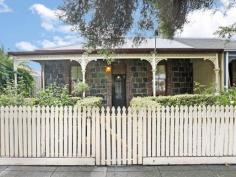 89 Swanston St Geelong VIC 3220 $490,000 Bluestone Cottage If you're after a prime piece of real estate in an unbelievably convenient location this charming Bluestone Cottage should be at the top of your list. From the moment you walk in the door you will be greeted with stunning traditional period features, such as high ceilings with ornate ceiling roses, sash windows and a cast iron fireplace. A central hallway separates the two bedrooms, both of which feature built in robes. This hallway then leads you to the formal lounge with an open fire place, dining or third bedroom. Further down the hall, you step down into the meals area & kitchen with a glass atrium - filling the rooms with light. The split system air conditioning & gas wall furnace will keep the house temperate, no matter what season. French doors lead out to the brick paved courtyard with a cottage garden. This period home has rear lane access to a remote controlled carport and small garage or extra storage space. Conveniently located to public transport and walking distance to Geelong CBD, this one not to miss out on. Property Snapshot Property Type: House Construction: Bluestone Land Area: 356 m2 Features: 10ft+ Ceilings Air Conditioning Built in Robes Close to Schools Close to Shops Close to Transport Courtyard Fireplace Formal Dining Room Formal Lounge Fully Fenced Yard Gas Gas Wall Heater Lounge Outdoor Living Storage Sunroom Verandah Workshop