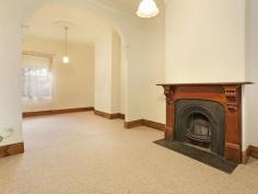 89 Swanston St Geelong VIC 3220 $490,000 Bluestone Cottage If you're after a prime piece of real estate in an unbelievably convenient location this charming Bluestone Cottage should be at the top of your list. From the moment you walk in the door you will be greeted with stunning traditional period features, such as high ceilings with ornate ceiling roses, sash windows and a cast iron fireplace. A central hallway separates the two bedrooms, both of which feature built in robes. This hallway then leads you to the formal lounge with an open fire place, dining or third bedroom. Further down the hall, you step down into the meals area & kitchen with a glass atrium - filling the rooms with light. The split system air conditioning & gas wall furnace will keep the house temperate, no matter what season. French doors lead out to the brick paved courtyard with a cottage garden. This period home has rear lane access to a remote controlled carport and small garage or extra storage space. Conveniently located to public transport and walking distance to Geelong CBD, this one not to miss out on. Property Snapshot Property Type: House Construction: Bluestone Land Area: 356 m2 Features: 10ft+ Ceilings Air Conditioning Built in Robes Close to Schools Close to Shops Close to Transport Courtyard Fireplace Formal Dining Room Formal Lounge Fully Fenced Yard Gas Gas Wall Heater Lounge Outdoor Living Storage Sunroom Verandah Workshop