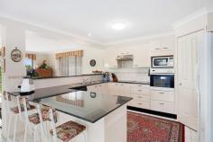 7 Kona Cres Bonnells Bay NSW 2264 STUNNING FAMILY HOME IN BONNELLS BAY This first class property is beautifully presented inside and out and represents excellent value for buyers looking for a large home in the prestigious 'Bonnells Bay Estate' and within a short walking distance to beautiful Lake Macquarie waterfront, The Bay Shopping Complex, Coles Supermarket, Cafes/Restaurants and quality schools. - Outstanding Master Built home spanning over 2 levels with waterviews. - Features 4 good sized bedrooms all with built-in wardrobes and ceiling fans. - King sized master suite with large ensuite, walk-in wardrobe and new carpets. - Formal lounge room with air-conditioning and formal dining room. - Stunning gourmet kitchen with granite bench tops, dishwasher, induction glass cook top and wall oven. - Spacious family room with combustion wood heater and air-conditioning. - Gorgeous main bathroom with separate toilet. - Powder room, sitting room, hobby/craft room and walk-in pantry room. - In-addition: carpets, light fittings, vertical blinds throughout the home. - Sparkling inground salt water pool with solar heating, pool cover and outdoor covered entertainment area. - Double lock-up garage with automatic remote door opener and internal access. - 6m x 6m shed, 2 x water tanks, wood shed, established gardens and vegetable patch. - Prime parcel of land approx 1,020m2 with adjoining council reserve giving direct access through double gates into a fully fenced backyard ideal for boats, caravans and trailers. This gorgeous home enjoys peace, privacy and a generous floor plan. Located in a much sought after area of 'Bonnells Bay' and surrounded by premium properties. This impeccable property will tick all the boxes for families. I suggest you take a look this could be the ONE!! Ring Leanne for your personal viewing today!! Property Snapshot Property Type: House Land Area: 1,020 m2