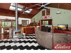 111 Quail St Cedar Vale QLD 4285 Unique and Private on 5.5 Acres This home is interesting and very different to most homes, it has soaring timber ceilings, exposed cedar walls and lots of interesting ornate features. The home is private and secluded and most of your time would be either inside next to the cosy wood heater or outside on the stunning rear timber deck enjoying the rural outlook and the surroundings. Inside the home consists of 3 bedrooms and 2 bathrooms and there is also an office that could be converted to a fourth bedroom. The kitchen comes with a stainless steel country cooker (900mm wide) and is positioned so easy access to the deck, to cater for family get togethers would be easy, and the kitchen also features a timber slab bench. The lounge room is open plan to the kitchen and off to the side is another lounge room with feature ceilings and cedar walls and French door. At the back of the home is the fully insulated and covered timber deck and it is delightful, many hours will be spent living and entertaining on the deck, from here you can see your fur babies in the paddocks and enjoy the seclusion and privacy that we all yearn for after a hard day’s work. Seriously if you are wanting a unique home with plenty of room for the kids and the pets – come and have a look at this home, it truly is very interesting and very different from your regular home, its position on a nice quiet cul de sac street and all the natural bushland will impress. Property Details Elders Property ID: 9748463 3 bedrooms 2 bathrooms 2 car parks Land Area 5.5 acres Double garage Related Elders Services Elders Home Loans Loan Calculator | 1300 LENDING Elders Insurance Request a Quote | 13 LOCAL