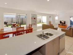 26 Ameen Circuit Mudjimba QLD 4564 $600,000' Modern Family Home With Side Access! Inspection Times: Sat 21/05/2016 01:00 PM to 01:30 PM Properties with side access are becoming a rarity with block sizes reducing in new estates. This property also has an extra wide driveway leading up to double gates opening out onto a concrete pad perfect for your boat, trailer or even motor home. This property is situated on a 605m2 corner block with a massive shed ideal for storing motorbikes, water sports equipment, tradies tools etc. Complete with four good size bedrooms, separate study/home office and two living areas, this property is truly a great option for families or the household that wants to spread out. The modern kitchen is fitted with neutral tones and has plenty of storage, gas cooktops and stone bench tops. When entertaining there is a large covered outdoor area adjacent to a grassy area that would be well suited to a lap pool. Ameen Circuit is so close to the Twin Waters Shopping Centre and only a short bike ride to the beach and river for a swim or fish. Features at a glance: - Four bedrooms plus study/home office - Master Walk In Robe & ensuite - Ceiling fans - Two separate living areas - lounge & kids retreat - Modern kitchen - dishwasher, gas cooktops, stone bench tops - Large shed - storage for motor bikes, water sports equipment, tools - Side access with room for boat, caravan, trailer - In-ground water tank - North facing covered outdoor area - Fully fenced block - great for kids & pets - 3.4km to Mudjimba Patrolled beach