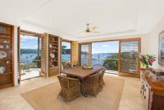 1802 Pittwater Rd Bayview NSW 2104 $7,500,000 A flawless absolute waterfront set on 1,130sqm 'Semloh' boasts a coveted northerly aspect and timeless architectural design by the renowned Walter Barda. This exquisite masterpiece represents the very best that the area has to offer, with direct Pittwater views captured from virtually every room and only 45 minutes to Sydney CBD. One of the few Bayview properties providing significant water depth at all tides, its impressive range of facilities can accommodate a large boat of up to 50 feet. There's a 107sqm jetty plus a slipway, fully equipped boatshed and a private sandy beach. Vast interiors are warm and inviting with abundant natural light. They include formal and informal living and dining areas, a billiard/a/v room, study and a self-contained lower level with a bar, wine cellar and a sauna. The property displays extensive use of bespoke timber throughout, while the floors are an attractive blend of Italian limestone and recycled blackbutt. Entertaining spaces comprise a gas heated salt water pool and spa, large deck, Tuscan inspired courtyard and a terrace. Four bedrooms have ensuites and the lengthy gourmet kitchen offers St George/Miele fixtures plus a walk through pantry. Other features include two gas fireplaces, alarm, air conditioning, ducted vacuuming, plantation shutters and a four car garage. Enjoying an immensely tranquil setting with direct access to boating clubs, this enviably private double brick home is simply extraordinary. Property Snapshot Property Type: House Land Area: 1,130 m2 Features: Air Conditioning