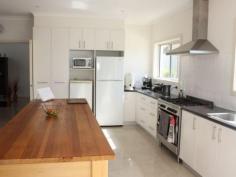 34 Tambo Blvd Metung VIC 3904 $785,000 OLIVE GROVE KEEN VENDORS ARE NEGOTIABLE Enjoy some extra income from approx. 500 mature olive trees on this 5 acre property plus B & B potential. 4 year old double storey home featuring 3 bedrooms all with ensuite bathrooms ( master with double shower, double vanity, bath, wc and bidet, all have access to the wide timber decked verandah which offers views to Tambo Bay and the surrounding area. The impressive entry area features double doors, water feature and porcelain tiles leading to a dining area with access to the rear al fresco area. The lounge is approx. 10.5 m x 6m and includes a solid fuel heater and split system air-conditioner and access outside. The kitchen is registered for commercial activities and includes a great solid timber work bench, industrial dishwasher and heaps of cupboard space plus there is an adjoining family area ideal for preparation of your olives and olive oil products or even cooking classes. 4th shower and toilet. Outside is a powered bungalow plus a separate office, 4 bay shed (1 Lockable), carport, 20,000 litre water tank, dam stocked with gold fish, and various plant and equipment (list available) Property Snapshot Property Type: House on acres Features: Balcony Coastal Ensuite Outdoor Living Workshop