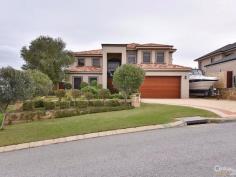 15 Baton Rouge Dr Mindarie WA 6030 $1,549,000 EXCLUSIVE DRESS CIRCLE ESTATE Immaculate & well presented Large Executive Home - packed with Features, a Pool and Ocean Views * This beautiful dble storey quality Executive home is over 412 sqms of internal living with 4 good sized Bedrooms (Kingsize Master is upstairs with downstairs Guest Room), 3 quality high spec Bathrooms, separate Study, 4 separate spacious Living areas (downstairs Lounge/Theatre, open-plan Family, Games/Bar areas and Upstairs areas leading to Balcony with Ocean views), combined Meals/Dining area overlooked by spacious & modernly appointed Gourmet Kitchen, with deluxe Laundry (with plenty of storage) and much more. * Inside main features include; grand tiled Entry to mainly tiled floors and quality carpeted to remaining areas including to stairs leading to the upper level & carpeted Bedrooms. Feature High Ceilings are to all Living areas t/out particularly above the Family with high Void to let in the natural light. Other features include; a sophisticated & wireless home smart Electronic Lighting and Security Alarm system - remotely controlled by your Iphone / Ipad - with ducted rev cycle A/C system, roof insulation, highest quality fixtures, fittings and window treatments t/out, skirting boards, steel balustrade staircase, including to the Kitchen complete with; all quality cooking appliances (Fisher Paykel dishwasher to stay), Granite stone / breakfast bar, classic Jarrah cabinets & doors, plenty of overhead & pantry cupboard space and more. All Bath/Powder rooms are adorned with quality plumbing fixtures & fittings & stone benches (incl floor-to-ceiling tiling to Master Ensuite). Additional features incl; dual gas storage HWS's, gas fireplaces to Dining & Master Bedroom, elegant wine cellar, glass tinted windows, bi-fold stacker doors to feature Games/Bar - Bar complete with Eco stone flooring, Granite benches, & Jarrah cabinetry, fridges and beer tap. The Theatre system is a highly sophisticated unit complete with; projector, fixed screen and cabinetry. * Outside main features include; Appealing street front elevation with external render brickwork, easy care front & rear fully retic lawns and gardens (off a shared bore). Games room opens to a large sparkling concrete below ground fenced Pool. To the front is a double garage (with shoppers access, w/shop area & remote door) and with paver brick tiled driveway & footpaths t/out. In addition to the garage is a good sized boat/caravan parking bay for that 3rd vehicle/vessel. The magnificent Ocean views can be enjoyed from various vantage points around the home - particularly from upstairs West facing cedar lined approx 16 sqm Balcony / Master Bedroom & Study. * All contained on a large 789 sqm block literally a short stroll down to Mindarie Marina, or 2-3 min drive to public & private Schools, Beaches, Parks, Ocean Keys Centre. The home compares to and is surrounded by some of Mindarie's finest homes and must be viewed to be fully appreciated, therefore ring Ray to view strictly by appt today. PROPERTY DETAILS $1,549,000 FROM ID: 371399 Land Area: 789 m²