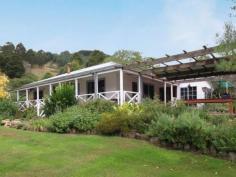 2005B Tarra Valley Rd Tarra Valley VIC 3971 $650,000 40 Hectares of unlimited opportunity with a beautiful country home. Impressive 4 bedroom renovated family home, with 2 comfortable living areas. Beautiful kitchen with black-wood cupboards, combustion stove and gas stove. All the trimmings you would expect in a country kitchen, giving this light and bright home the feeling of peace and tranquility. Spacious dining room, just the thing for special family occasions or every day living. Bathroom has separate shower and bath and 2 toilets. Solar hot water. Great outside living area. Extensive and beautifully established gardens with 2 spring fed dams and orchard. Bordering Tarra Bulga National Park and the Tarra River. 30ac tree plantation of Shining Gum, Yellow Stringy & Black-wood, good fencing, lane ways and annual rainfall. Annual income for rental of emergency tower site. Excellent new yards, designed for easy use with sheep and cattle. Shearing shed, workshop, 5 bay near new machinery shed. Additional 5 bay machinery shed, and another shed. 2 x 10,000gal and 1x5,000gal gravity fed water tanks. Close proximity to the newly opened Strezelecki walking track. School bus to gate. Property Snapshot Property Type: House Construction: Weatherboard Land Area: 40 ha