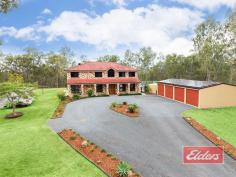 140 Canterbury Dr Mundoolun QLD 4285 $659,000 35 Squares, 5 Acres, 5 Bedrooms … Space and privacy abound here on this elevated 5 acres, with views to Mount Tamborine. The cul de sac position ensures a peaceful and tranquil environment, and you will be pleased to discover a very well specified family home awaits your inspection, with ducted air-con inside and an impressive pool area and plenty of shed space outside. Double door entry leads into the entry hallway, with feature stairway leading to the upper level while the main hallway continues through to the family room, with mountain views beyond. The living areas are sure to impress, with a very comfortable formal lounge, leading through to a formal dining (currently used as an office). Then there’s the large family room with equally impressive rumpus, both of which enjoy easy access to the outdoor entertainment area. In addition, there is another lounge / or activity area upstairs, and if stairs are a concern, well no need to worry – there’s even a lift! The hub of the home is undoubtedly the kitchen and this will impress – extensive bench and storage space (plus a walk-in pantry), await your inspection, all of which is complimented by quality appliances while the outlook is simply superb – it’s a kitchen that you will want to be in, rather than having to be in ! Cupboard space too, will impress with a plentiful supply both upstairs and down, while the under stairs cupboard adds even more storage. Bedroom space is excellent, with 4 of them having large built-ins, while the huge master bedroom has a large walk-in robe and suitably impressive en-suite, as you can see in our images. The family bathroom too will not disappoint and being a 2 story home, there is also a downstairs toilet with wash basin for your convenience. Moving outside, you will find a large and comfortable outdoor entertainment area, with servery out from the kitchen, where you will be able to enjoy lovely mountain views, and an equally impressive pool area, with a large in ground salt pool, with in-built spa at one end and a cascade water feature at the other. It’s the perfect focal point for your family, and a great place to relax and call home. The shed space is also impressive, in addition to the 4 bay shed beside the house (which has a 28 panel 5.2 Kw solar power system on one side of the roof), you will also find, on the opposite side of the courtyard, additional shed space and covered vehicle storage - perfect for a horse float, bobcat or more vehicles and equipment. So if you are struggling to find that elusive large family home, then I’m tempted to say that they don’t come much bigger or better than this - you will enjoy a quiet rural position with stunning views, yet you are perfectly positioned too for easy access to both the Gold Coast and Brisbane CBDs. Property Details Elders Property ID: 9766834 5 bedrooms 2 bathrooms 8 car parks Land Area 4.94 acres 8 car garage