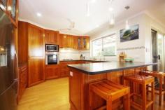 63 Hillcrest Ave Nambour QLD 4560 $595,000-$635,000 DOCTOR'S OWN MAJESTIC HOME SOLID 70s BUILD WITH MODERN CENTURY MAKE-OVER 1ac+ GRAND POOL VIEWS LOCATION One of Nambour's finest residences in a superb location elevated with lush views to the east over town including an ocean glimpse. Modern rendered brick with solid hardwood frame to suit a big family. The vendors have spent an enormous amount of time and money inside and out to prepare their wonderful and expansive home for sale; this even includes re-wiring and re-plumbing! Upstairs comprises 4 robed bedrooms (master with large ensuite and long walk-in robe), 2 bathrooms and spacious open plan living with bamboo flooring. The large kitchen boasts Indonesian rosewood carpentry plus stainless steel appliances, gas hotplates, plumbing for fridge, soft-close drawers and lead-lighting. 2 air-conditioners plus combustion fire place. Complete with internal timber stairs to downstairs storage basement currently utilised for large extra living with amenities. Plenty of storage space. Outside is a treat; with 3 covered entertainment areas and a sparkling re-surfaced pebble pool complete with night-lit feature wall and beautiful surrounds. The private and peaceful over 1 acre block is wonderfully rock-walled and landscaped with a variety of vegetation including ornamentals, fruit trees and natives. Double carport with extra capacity for a trailer. Fenced for a dog. Tranquil culdesac position. Property Details Elders Property ID: 9761815 4 bedrooms 3 bathrooms 2 car parks Land Area 5901 square metres Double carport