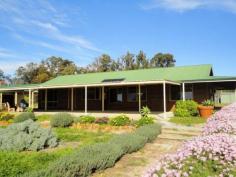 230 Honeyeater Glade Chidlow WA 6556 $549,000 HOME SWEET HOME ON 5 ACRES Escape the hustle and bustle of city living in this lovely, well presented three bedroom, north facing, country homestead built in 1999 by Ross Squire Homes which sits together with a triple carport & storage atop a fenced and paddocked 5 acres adjoining reserve and situated in a quiet cul de sac with a lovely valley aspect. FEATURES • Well presented 3 bedroom country homestead • Built 1999 by Ross Squire Homes • All bedrooms with BIRs • Spacious open plan living with high raked ceilings • Large lounge with atrium • Master suite with air conditioning • Verandahs front & rear plus patio • Triple carport with storage area • Garden shed & chicken enclosure • Water tanks & colorful gardens • Cleared & fenced 5 acre (approx.) block • Suit horses, alpacas, etc • Close to beautiful Lake Leschenaultia • Easy commute to Mundaring, Midland & airport Enter through the front door and be captivated by how light and bright the home is. An atrium makes a lovely feature separating the two living areas of the home. Both its large lounge and spacious open plan living area having tiled floors and high raked ceilings with exposed beams whilst the practical kitchen offers a lovey view through its large picture window. The bedrooms are carpeted, all have built-in robes and the master suite has air conditioning. Verandahs front and rear add to the character of the home whilst the patio adds further functionality. A triple carport with a storage area is conveniently located at one end of the home. Other improvements include water tanks, chicken enclosure and garden shed. Would be suitable for horses, alpacas and the like. Be quick for this one. Other features: Built-In Wardrobes Property Details Elders Property ID: 8541545 3 bedrooms 1 bathrooms 3 car parks 3 car carport Air Conditioning