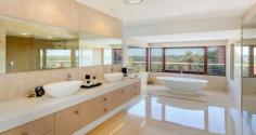 6 Old Ferry Road, Banora Point NSW 2486 "THE COVE" - Award Winning Contemporary Masterpiece Sweeping 180 degrees ocean and hinterland views from Fingal to Byron Bay Lighthouse with meandering waterways dominate from almost every room of this spectacular four bedroom contemporary masterpiece. Designed by renowned Noosa architect Paul Clout and constructed by award winning Hammerhead Builders, this extremely spacious home offers a wonderful sense of relaxed comfort. The main expansive living area incorporates an award winning kitchen with Butlers kitchen (designed by Lee Hardcastle) which flows to the outdoor entertaining area comfortably warmed by sensored heating. Below sits the resort style pool and gazebo against mature landscaped gardens. Also on this level are two private en suite guest rooms, a well appointed office and generous dual entertaining areas with a fully insulated wine cellar. Upstairs a floating glass bridge leads to a magnificent master suite, complete with an enviable custom designed walk-in robe and bathroom featuring floor to ceiling marble and a free standing marble bath positioned to take the coastal views that stretch to the horizon. The second en suite bedroom is equally opulent with its own study and private covered deck set against a lush garden backdrop. The north wing has an intimate second living area with Calcutta marble fireplace. Throughout natural stone walls, travertine external paving, spotted gum flooring, copper downpipes, custom cedar windows and bi fold doors cap a truly remarkable residence built with attention to detail, highest quality finishes and craftsmanship, functionality and complete privacy. This iconic residence is ready for the discerning buyer who seeks an exceptional residence. * Two Master Suites with marble Bathrooms and large Dressing Rooms * Heated flooring to En suite, Villeroy and Boch fittings * Glass walling in Showers, automated Window Coverings * Fully sound proofed 10-seat home Theatre * Intergrated master Kitchen with Butlers second Kitchen-Pantry * Sports/Pool Room and Putting Green * Resort-style Pool, BBQ area, Gym with Steam Room * C-Bus technology and ducted Air Conditioning