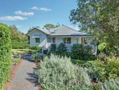7/255 Witta Road Maleny QLD 4552 $549,000 Country style at Witta - Peace and Privacy Assured If you are longing for the look and feel of a Queenslander, without the work, you will love this beautiful home! • Beautifully renovated Queenslander set on 2916m2 block • Fresh paint inside and out - sit back and relax.... • 4 light and airy bedrooms, main with walk in robe and ensuite • Country style kitchen with plenty of cupboard space and servery to the verandah • Stunning polished hardwood timber floors throughout and 10' ceilings, • All seasons catered for with a cosy wood fire burner and split system air conditioning • Sunny North facing verandahs on three sides with new powder coated aluminum railings, no maintenance • 3 car accommodation under the house plus workshop area • Extra high 6m x 9m carport for caravans or additional cars • Easy care, low maintenance, landscaped gardens including a vege patch and abundance of fruit trees Escape to the country and enjoy the time and effort already spent. Call RE/MAX Hinterland to arrange your private viewing. This one is PRICED TO SELL and sell quickly it will!