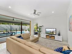 39 Kingfisher Dr Upper Kedron QLD 4055 A SANCTUARY OF LUXURIOUS PROPORTIONS Set amongst breath-taking grounds on a private 1265m2 sanctuary. Bask in a family residence of truly grand proportions with an arrangement of living areas, stunning outdoor entertaining options and modern comfort. With the benefits of zoned accommodation and a premium sense of security, this is a home that excels in every category of living. Not only does this exquisite lifestyle residence present a sizeable upgrade in terms of living space, it also offers an upgrade in terms of style, luxury and class. Gorgeous stone benchtops are the face of the impressive gourmet kitchen, which is equipped with quality appliances, abundant storage and walk in pantry. A radiant informal lounge and dining arrangement capture the essence of high-end style. Indoor-outdoor living, meanwhile, forms the communal heartbeat of the home, with both the kitchen/meals and lounge setting stepping out through stacker doors onto a picturesque outdoor area, all overlooking the sparkling in-ground pool to present seamless indoor-outdoor living. While the home is big on entertaining, it's also practical for everyday family living. This is evident in the successful zoning of the spacious bedrooms away from the main living areas to achieve a premium level of peace and quiet. Parents are given the five-star treatment courtesy of a hotel-style Master suite, styled with large walk-in robes and ensuite. Additional bedrooms are conveniently tucked away in a secluded wing off the main living zone and feature an activity zone and serviced by a family bathroom. This impressive home that's destined to change a family's life for the better also features formal lounge, ducted air-conditioning, heated pool, 1.9kw solar system, water tank and store room. Conveniently located within moments of St Andrews Primary School, Ferny Grove State School, Ferny Grove High School, local shopping village and Train station this home is set in a premier location of Upper Kedron and will not disappoint. PROPERTY DETAILS ID: 379045 Land Area: 1265 m²