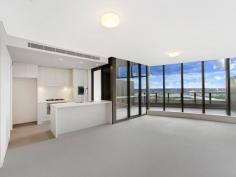 C2402/7 Australia Avenue Sydney Olympic Park NSW 2127 $1,050,000 - $1,100,000 Split-Level Luxe This one of a kind two-level apartment situates on the top floors of an ultra-modern and secure high-rise apartment block. The spacious living area on the lower level flows to the sky balcony and overlooks amazing 180 degree water views of the Parramatta River, Sydney Olympic Park and Sydney CBD. All of which can also be seen from the chef's quality kitchen which features caesar stone bench tops, Smeg stainless steel appliances and gas stovetop. The second level contains both bedrooms that are also gifted with the same spectacular views. A main bedroom incorporates a walk-in wardrobe and ensuite whilst the second houses a built-in. The two luxury bathrooms in the home are complimented by a third toilet and powder room in the lower level laundry. Ducted air conditioning, video intercom, secure car space, storage cage and outdoor gas outlet add to the convenience of the apartment's surroundings. With trains, buses, cafs, popular restaurants and all that the Sydney Olympic Park precinct has to offer literally at your doorstep, this exceptional residence is a must see.
