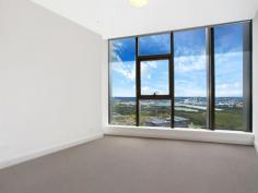 C2402/7 Australia Avenue Sydney Olympic Park NSW 2127 $1,050,000 - $1,100,000 Split-Level Luxe This one of a kind two-level apartment situates on the top floors of an ultra-modern and secure high-rise apartment block. The spacious living area on the lower level flows to the sky balcony and overlooks amazing 180 degree water views of the Parramatta River, Sydney Olympic Park and Sydney CBD. All of which can also be seen from the chef's quality kitchen which features caesar stone bench tops, Smeg stainless steel appliances and gas stovetop. The second level contains both bedrooms that are also gifted with the same spectacular views. A main bedroom incorporates a walk-in wardrobe and ensuite whilst the second houses a built-in. The two luxury bathrooms in the home are complimented by a third toilet and powder room in the lower level laundry. Ducted air conditioning, video intercom, secure car space, storage cage and outdoor gas outlet add to the convenience of the apartment's surroundings. With trains, buses, cafs, popular restaurants and all that the Sydney Olympic Park precinct has to offer literally at your doorstep, this exceptional residence is a must see.