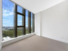 C2402/7 Australia Avenue Sydney Olympic Park NSW 2127 $1,050,000 - $1,100,000 Split-Level Luxe This one of a kind two-level apartment situates on the top floors of an ultra-modern and secure high-rise apartment block. The spacious living area on the lower level flows to the sky balcony and overlooks amazing 180 degree water views of the Parramatta River, Sydney Olympic Park and Sydney CBD. All of which can also be seen from the chef's quality kitchen which features caesar stone bench tops, Smeg stainless steel appliances and gas stovetop. The second level contains both bedrooms that are also gifted with the same spectacular views. A main bedroom incorporates a walk-in wardrobe and ensuite whilst the second houses a built-in. The two luxury bathrooms in the home are complimented by a third toilet and powder room in the lower level laundry. Ducted air conditioning, video intercom, secure car space, storage cage and outdoor gas outlet add to the convenience of the apartment's surroundings. With trains, buses, cafs, popular restaurants and all that the Sydney Olympic Park precinct has to offer literally at your doorstep, this exceptional residence is a must see.