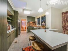 1 Carramar Ct Bayswater VIC 3153 Huge Family Entertainer FIXED DATE SALE 8TH OF NOVEMBER 2016 (UNLESS SOLD PRIOR) Big enough for almost any family and kept in beautiful condition by one owner who has been here for 30 years, this is a home of tried and tested quality in a great position near buses and local schools with Knox City just minutes away. On a corner block surrounded by colourful gardens, the home is fronted by a classic brick faade and great car accommodation including a triple carport and an additional garage/workshop. Inside, presentation is millimetre perfect with great living options including a large formal lounge/dining room with gas log heater, a huge separate rumpus room and a pristine, fully equipped kitchen with adjoining meals area. For those with a growing family there are 5 robed bedrooms including the master with a walk in wardrobe and a semi-ensuite plus a family bathroom on each level. To keep Melbourne's weather extremes at bay, ducted heating and evaporative cooling are welcome additions while outside you find a covered deck, a backyard with 2 paved patio/play areas and gardens kept in check with 4,500L of water storage.
