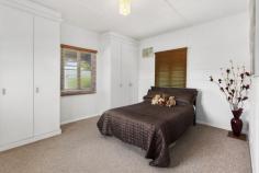 200 Glebe Rd Booval QLD 4304 $318,000 Affordable & Handy to everything It's got charm and plenty of appeal, you just can't beat the character of these solid post war timber homes. The current owners are moving to Brisbane and keen for someone else to fall in love with their beautiful home. This property went through a full renovation a few years back that included new plumbing, new stumps, new roof , new wiring, new deck etc. All the big ticket items are done so no need to stress about major repairs. Also included in the reno was a new kitchen, complete with Blanco appliances, stone bench tops, dishwasher and ample storage space. There are 3 big generous sized built-in bedrooms, the surprising feature in the master bedroom is the ensuite (rarely seen in this price bracket) and its own private door out to the rear deck. This home also has the nice things you would expect, polished floors, high V.J. walls and neutral colour scheme. Designed with living in mind, the lounge, the dining and kitchen area share a good sized open planned living space and with easy access out to the impressive 4mx6.5m deck, all your living & entertaining needs are satisfied. The property also boasts a powered tandem shed, with its own driveway,offering both a secure storage area and safe under cover parking (ICC approved). All this plus more on a flat (50metre deep) 759sqm block right in the heart of the ever popular suburb of Booval. Easy walk to Big W shopping centre, take-aways, schools and the famous Ipswich Turf Club plus it's only a few minutes' drive to Booval train station for easy commute back to Brisbane. This is defiantly a hot property in a great position, so don't delay, as it won't stay around for long. Flood Status- Not effected in Jan 2011. Property Features Land Size : 759 m2 Built In Robes Deck Dishwasher Ensuite Floorboards Fully Fenced Secure Parking Shed Split System AirCon Water Tank