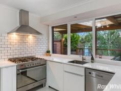 18 Terama Cres Bayswater VIC 3153 Prepare Yourself to be Captivated by This Sleek and Modernised 3 Bedroom, 2 Bathroom, Alluring Brick Beauty. Freshly renovated with room for additional touches, and graced with gorgeous natural light and immaculately tiled flooring, this serene retreat will quickly grab your attention with an open plan living and meals area, adjoining elegantly redesigned and renovated kitchen, featuring stone bench tops with quality stainless steel appliances and dishwasher, 2nd living, spacious and light-filled master bedroom with walk-in robe and chic ensuite, 2 further bedrooms own built-in robes, tasteful bathroom with a separate toilet, on a large block with established gardens and a private rear yard perfect for relaxing while taking in mountain vistas, or entertaining on the expansive undercover alfresco deck. A fantastic investment opportunity, a perfect match for those looking for an updated family abode, or set to delight first home buyers, this residence also features a separate laundry with external access, A/C, gas heater, dual roller blinds, external blinds, and a lock up garage. With a superb location only moments to, Bayswater west primary school, reserves, buses, Bayswater train station, Westfield Knox, and Eastlink access.
