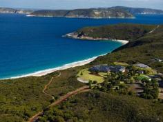 1320 Nanarup Road, Albany WA 6330 MAITRAYA: A World Class Private Estate and Business Description Overlooking Nanarup Beach and the Southern Ocean, Maitraya is situated 20 minutes from Albany in the Great Southern region of Western Australia. Maitraya, 'Place of Loving Kindness', is a sanctuary spanning 550 acres of pristine land, which offers privacy, functionality and abundant natural beauty. In addition to being a magnificent home, Maitraya is run as a prosperous private retreat ideal for weddings and functions, with accommodation for up to 60 guests across the main house, Fisherman's Lodge, Aviator's Cottage and Country Chalets. Maitraya's main house boasts spectacular views of the ocean from all rooms, in all seasons, and is supremely comfortable in all weather; the central atrium provides an impressive tropical garden and the ability to naturally regulate the home's temperature, and the pool, spa and sauna are used year round. The eight double bedrooms each have en suites and walk-in-robes, and both kitchens are fully equipped and spacious. The living spaces include formal lounge, theatre, superbly fitted dining room, conference and living rooms. Maitraya's leisure opportunities include a tennis court, children's indoor play ground, and a lake which is ideal for kayaking as well as being bountiful with marron. Nanarup and Salmon beaches, including a private tranquil lagoon, are accessed in under five minutes via private walking trails, which also provide access to artworks and birdwatching. The property is securely gated and can be accessed by motor vehicle or directly by aircraft, using Maitraya's private airstrip and helipad. Maitraya is an exquisite, unique and multi-faceted property, combining world class luxury living, a thriving venue for corporate functions and weddings, and livestock revenue. Note: Maitraya is to be sold 'as a going concern' with confirmed and future bookings for weddings, events and functions. Read more Features Bedrooms : 16 Bathrooms : 14 Below Ground Pool : 1 Carport : 12 Water Closets <%=featureName %> View more features Summary Type : House Size : 2246000 sqm